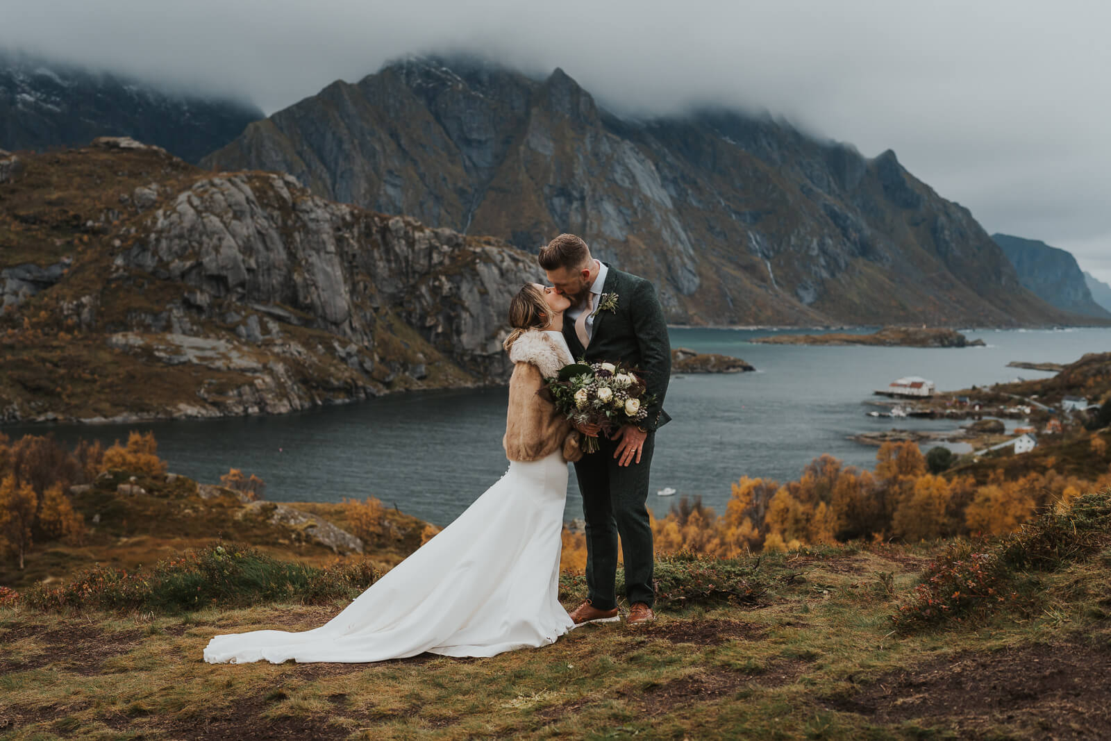 Elopement couple kissing on a mountain in Lofoten