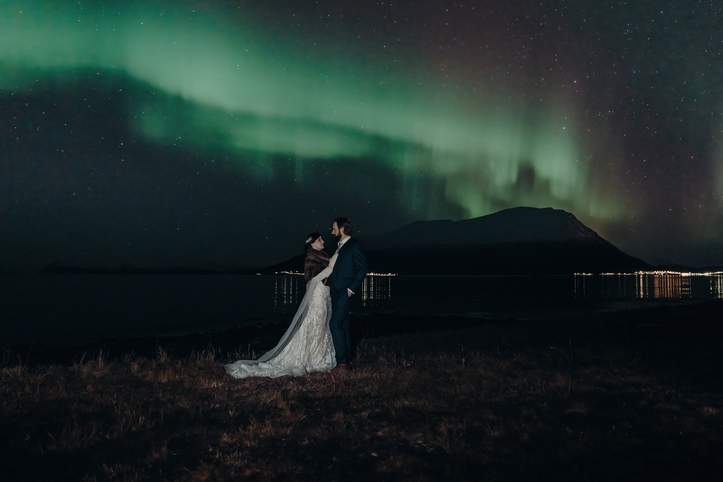 Wedding couple under the northern lights in norway