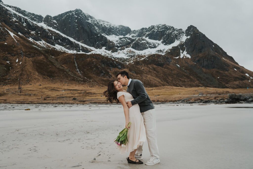 Elopement couple kissing on a beach in Lofoten